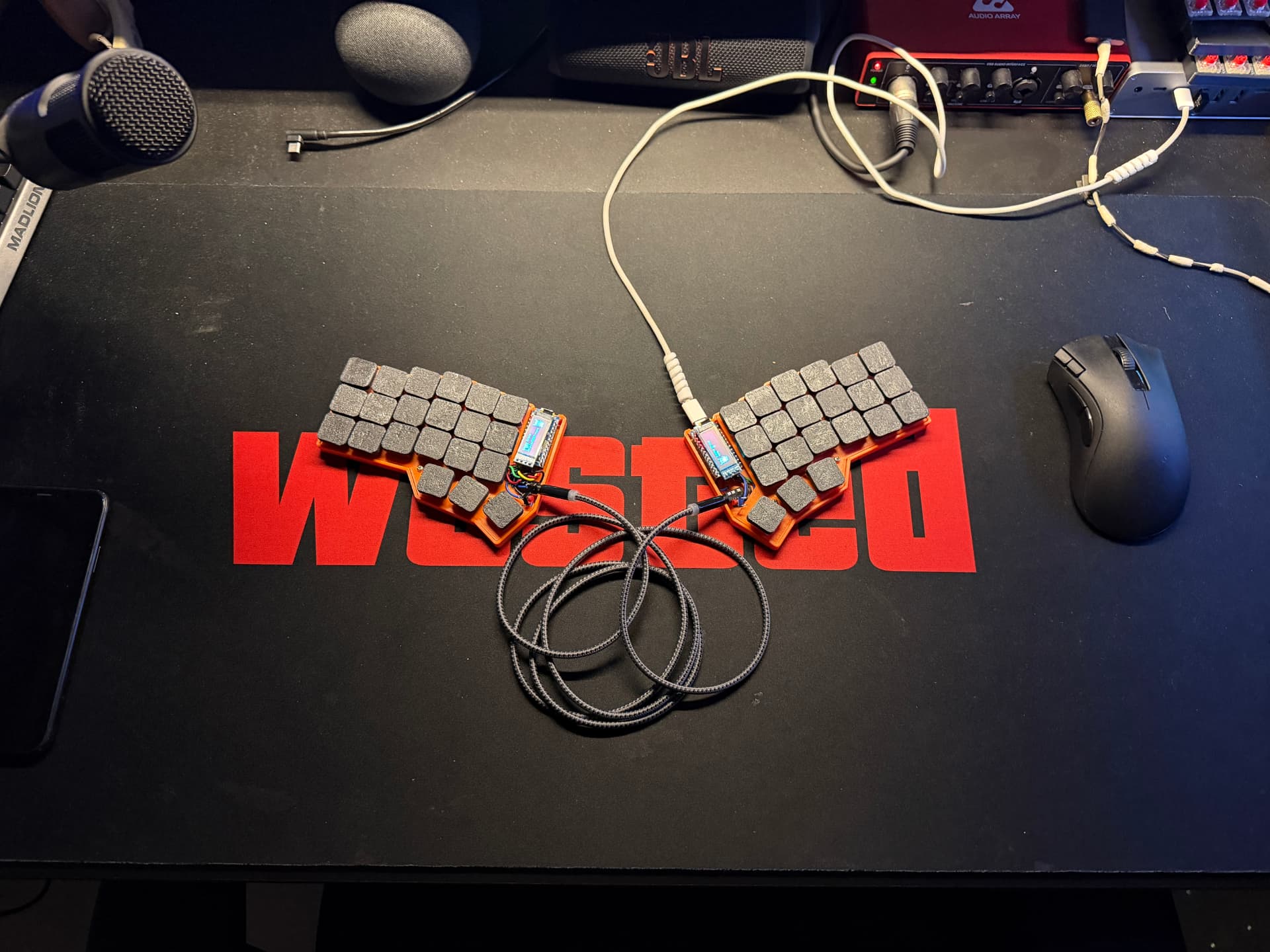 A real Keymo split keyboard arranged on the workbench